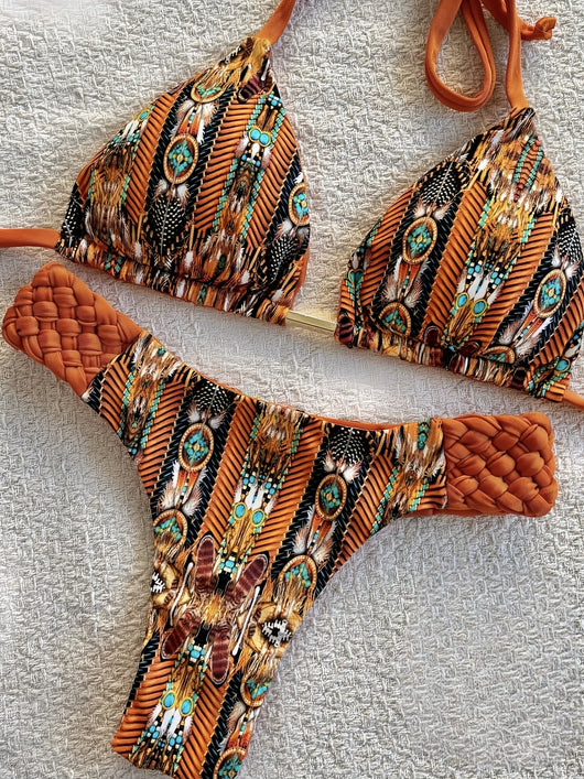 Women's blue, white, and gold marble print bikini with a triangle halter top and braided rope side details. - Image 15
