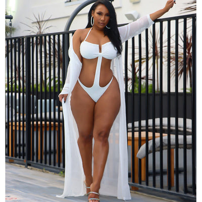 Woman in black mesh see-through long sleeve swimsuit cape over a matching cutout bandeau swimsuit with hot drilling. - Image 14