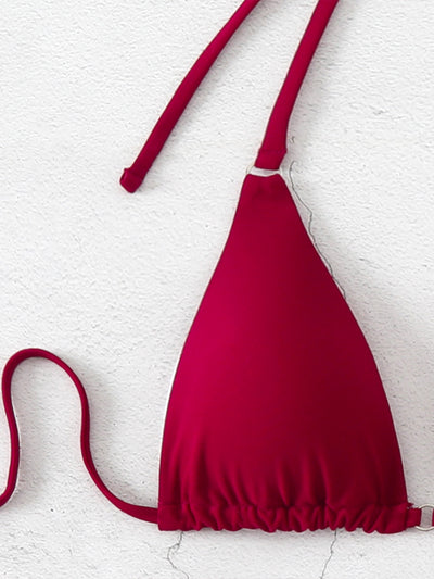 Brown bikini set with triangle top and thong bottom, featuring adjustable straps, displayed on a marble surface. - Image 9