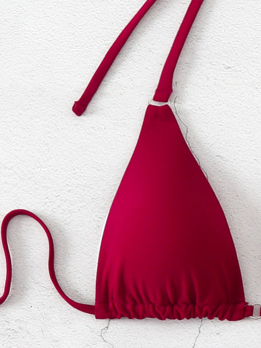 Brown bikini set with triangle top and thong bottom, featuring adjustable straps, displayed on a marble surface. - Image 9