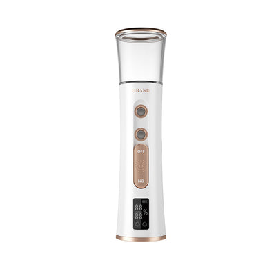 White and rose gold double-spraying nano mist sprayer with a clear reservoir, next to its product box and USB cable. - Image 5