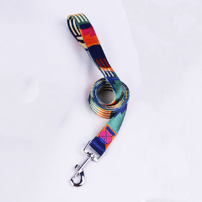 Pink, black, and white patterned polyester dog leash with a silver metal swivel snap hook, coiled on a white background. - Image 19
