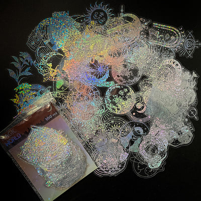 Transparent holographic butterfly laser stickers in various designs, including floral and moon elements, shown individually and in a 100-sheet pack. - Image 7