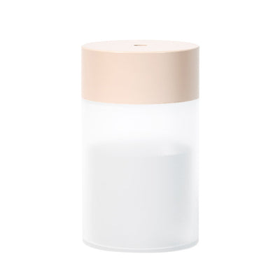 Cylindrical humidifier with a frosted white body and a light pink top, featuring a small mist outlet. - Image 4