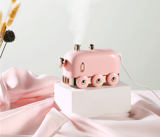 Pink retro mini train ultrasonic humidifier and aroma diffuser with rose gold accents on a white background. - Image 9