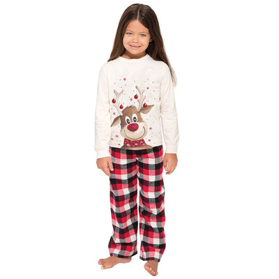 Family of four and a golden retriever wearing matching white long-sleeve reindeer tops and red plaid pajama pants. - Image 22