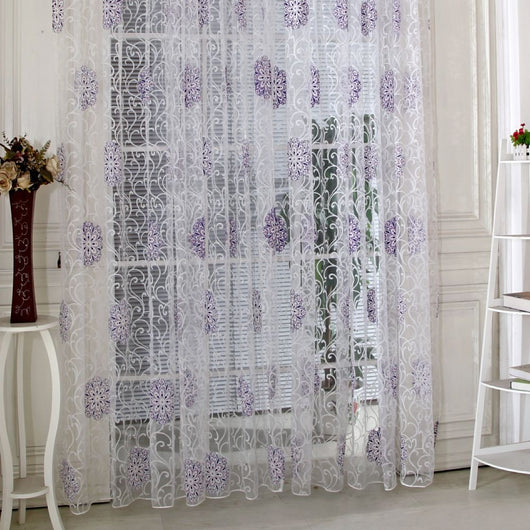 Sheer white European-style floral curtain with brown and gold patterns, hung on a gold rod in a bedroom. - Image 11