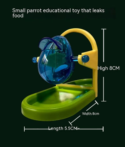 Small blue, yellow, and green parrot food leakage toy with a rotating dispenser and catch tray. - Image 5