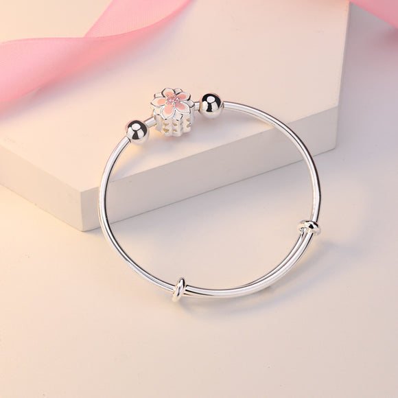 Pulsera Giratoria de Cobre con Cisne y Cuentas Plateadas