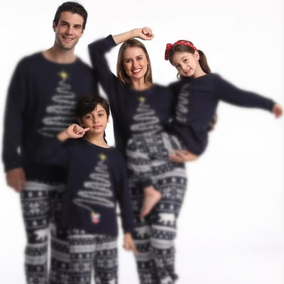 Family of four wearing matching red Christmas pajamas with a Christmas tree graphic and fair isle pattern. - Image 8