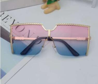 Frameless conjoined sunglasses with gold metal frame and braided detail, featuring brown gradient lenses. - Image 11