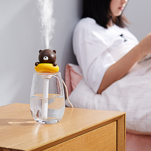 Two white and pink rabbit-shaped mini portable humidifiers, one facing forward and one showing the USB port. - Image 2