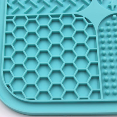 Gray silicone pet licking pad with four textured sections, designed for slow feeding and anti-choking. - Image 49
