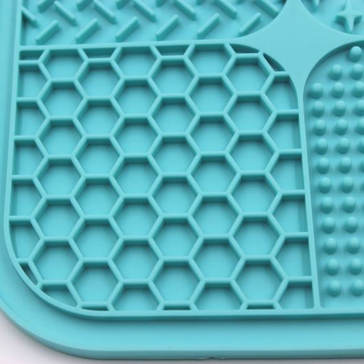 Gray silicone pet licking pad with four textured sections, designed for slow feeding and anti-choking. - Image 49