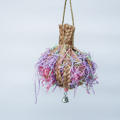 Woven straw paper parrot toy filled with colorful shredded paper, featuring a small bell at the bottom. - Image 3