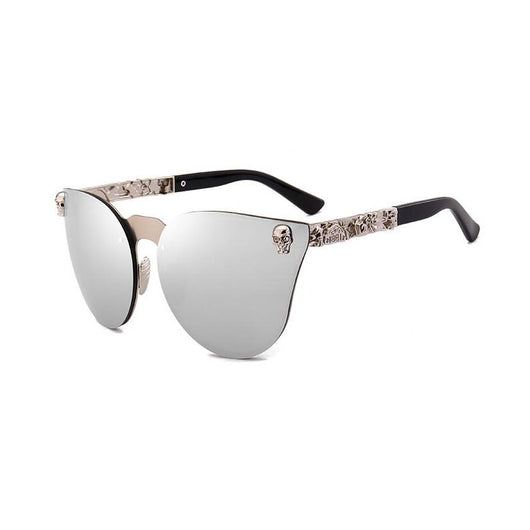 Pink mirrored cat-eye sunglasses with gold-toned frames, skull, and floral embellishments on the temples. - Image 11