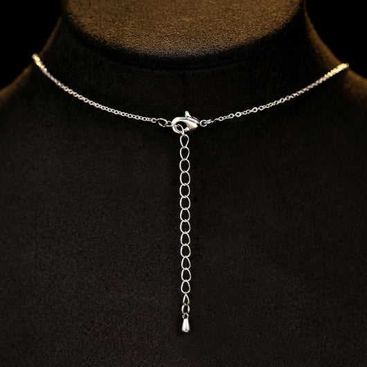 Elegant jewelry set with a silver-tone necklace and matching stud earrings, featuring blue and clear floral gemstones. - Image 10
