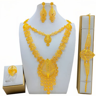 Gold-colored fashion jewelry set with a two-layer necklace, drop earrings, bracelet, and ring, all featuring intricate leaf and floral filigree designs. - Image 8