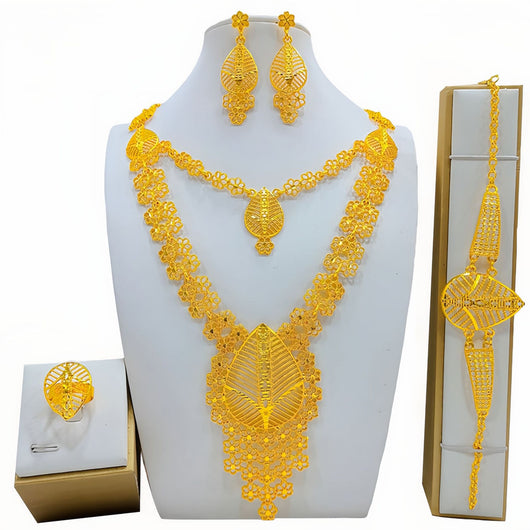 Gold-colored fashion jewelry set with a two-layer necklace, drop earrings, bracelet, and ring, all featuring intricate leaf and floral filigree designs. - Image 8