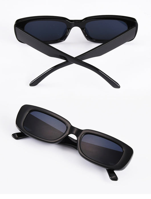 Rectangular tortoiseshell sunglasses with a small frame and dark gray lenses, angled on a white background. - Image 40