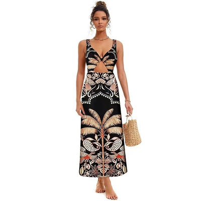 Black one-piece swimsuit with an asymmetrical top and matching long skirt, featuring a tropical palm tree and bird print. - Image 5