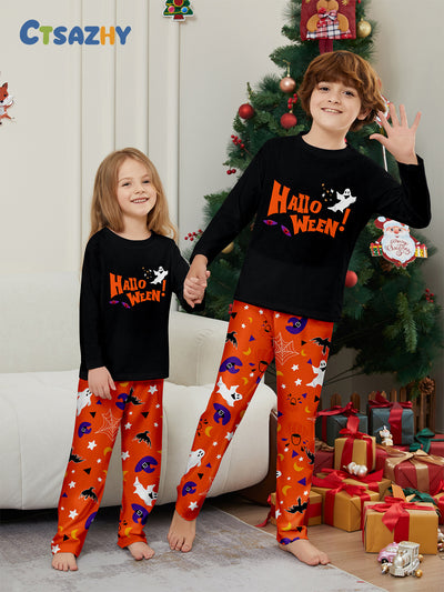 Family of four wearing matching black and orange Halloween long-sleeve pajamas with ghost and bat prints. - Image 8