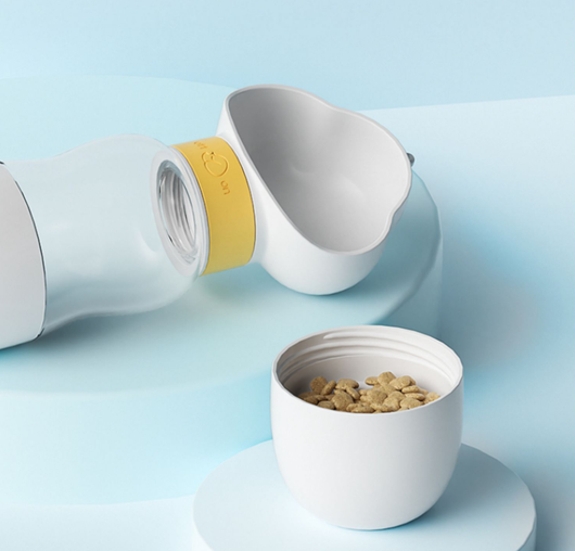 Yellow and clear portable pet water bottle with integrated drinking bowl and separate food container for walking dogs. - Image 27