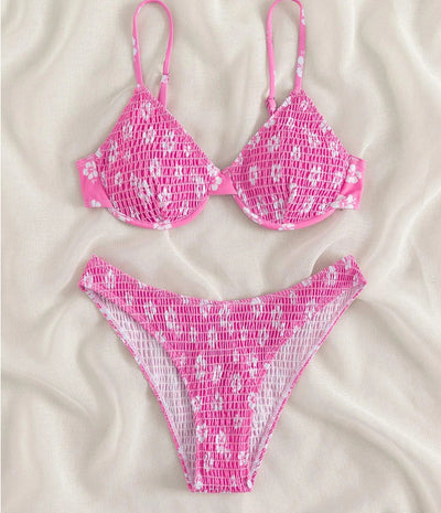 Periwinkle blue two-piece swimsuit with white floral pattern and ruched texture, featuring an underwire bikini top and high-cut bottoms. - Image 19