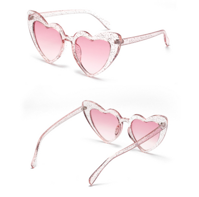 Heart-shaped tortoiseshell sunglasses with light brown lenses on a white background, perfect for women. - Image 11