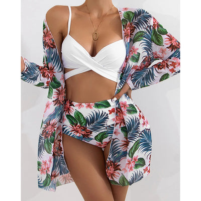 White criss-cross bikini top with high-waisted tropical floral print bottoms and matching long-sleeved cover-up. - Image 21