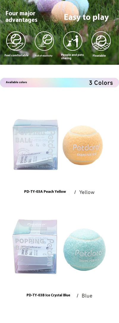 Peach yellow Petdora high elastic tennis ball dog toy next to its clear iridescent 'Popping Ball' packaging. - Image 8