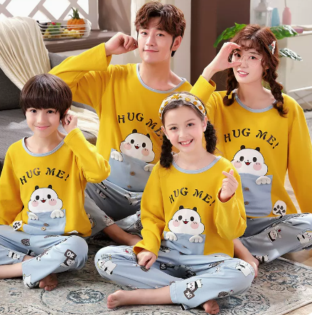 Family of four wearing matching yellow long-sleeved cotton pajamas with a cute panda design and "HUG ME!" text. - Image 6