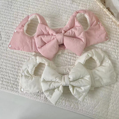 Creamy-white plush dog harness with a large decorative bow on the back, worn by a small poodle-like dog. - Image 7