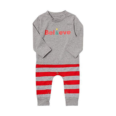 Family of four in matching grey long-sleeve tops and red striped pants, posing in a festive holiday setting. - Image 10
