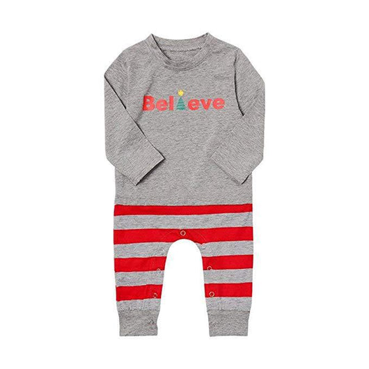 Family of four in matching grey long-sleeve tops and red striped pants, posing in a festive holiday setting. - Image 10