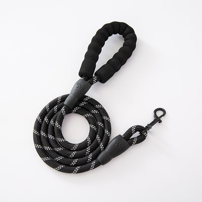 Red and black dog harness with reflective strips, adjustable straps, and a top handle for secure pet control. - Image 29
