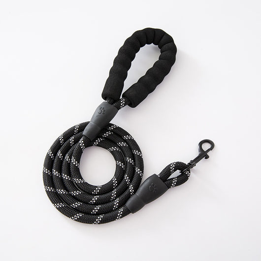 Red and black dog harness with reflective strips, adjustable straps, and a top handle for secure pet control. - Image 29