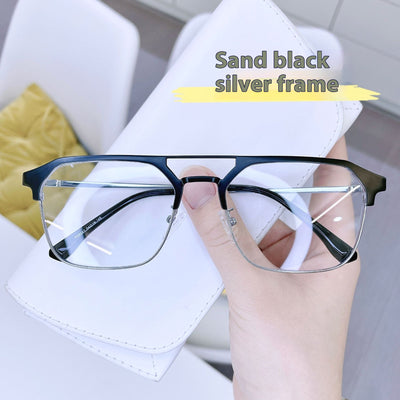 Anti-blue light glasses with a sand black and silver double beam frame, held against a white case. - Image 13