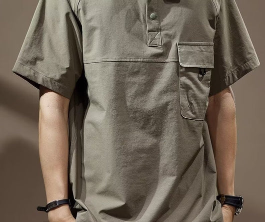 Men's khaki short-sleeve polo shirt with a lapel collar, three buttons, and a large flap chest pocket with a D-ring. - Image 13