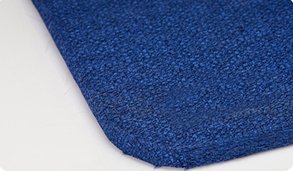 Blue and white striped fish-shaped sisal cat scratching post with a purple base, next to a black and white cat. - Image 11