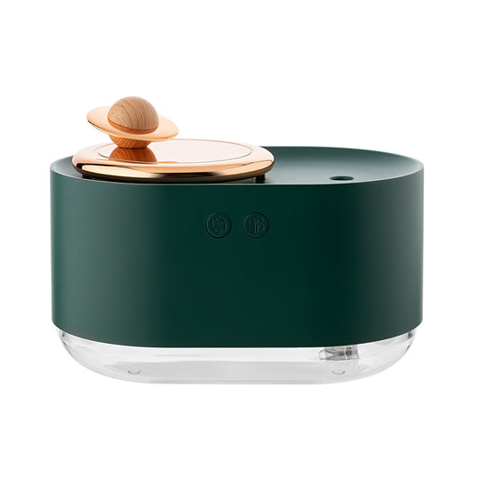 White USB rechargeable mini humidifier with a rose gold top accent and a wooden planet decoration. - Image 14