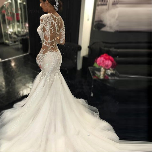 Vestido de Novia Elegante con Encaje Delicado y Silueta Estilizada