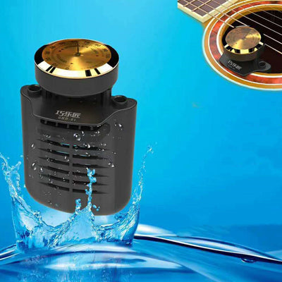 Black guitar humidifier with a gold hygrometer dial, shown with water splashes against a blue background and a guitar soundhole. - Image 8