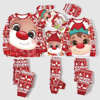 Baby wearing a red and white Christmas pajama set with a fawn graphic, sitting on a white blanket. - Image 20
