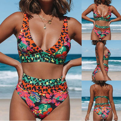 Women's high-waisted bikini with a vibrant floral and leopard print in blue, orange, and green, at the beach. - Image 2