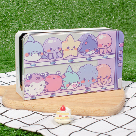 Clear protective case for Nintendo Switch OLED with cute marine animal design, including paw print thumb grips. - Image 6