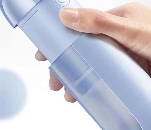 White portable electric dental water flosser with a clear nozzle and retractable water tank for oral hygiene. - Image 9