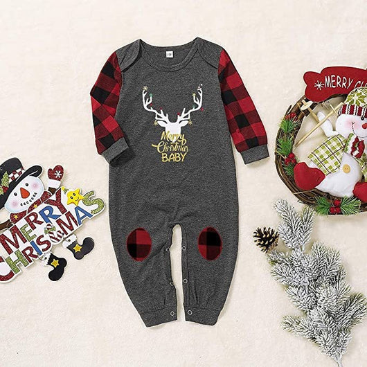 Woman wearing a Christmas pajama set with a dark gray 'Merry Christmas MOMMY' reindeer top and red and black plaid pants. - Image 6
