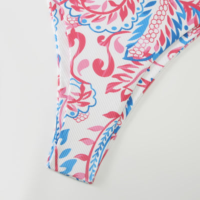 White ribbed two-piece swimsuit with pink and blue paisley floral print, bandeau top, and high-cut bottoms. - Image 15