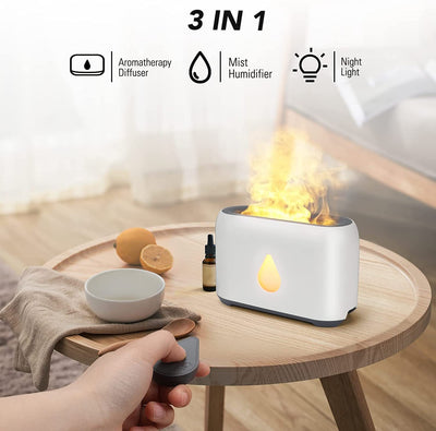 White aroma diffuser with a 3D flame effect and a gold water droplet icon, shown with a remote control. - Image 4